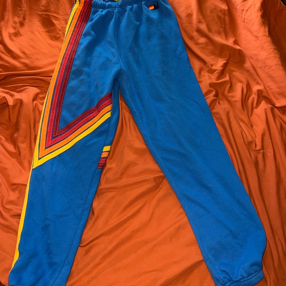 Aviator Nation Joggers with Red and Yellow Stripes.